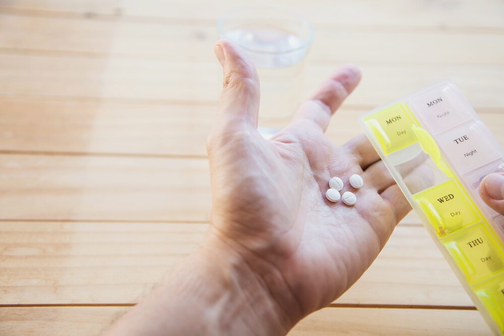 Man is going to eat medicine tablet 